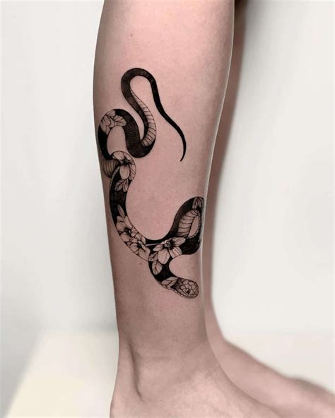 snake tattoos on leg|97+ Breathtaking Snake Tattoos for Women with Meaning